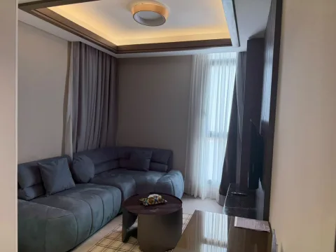 Appartement 2 pièces 305 de The Stay : le salon avec canapé d’angle